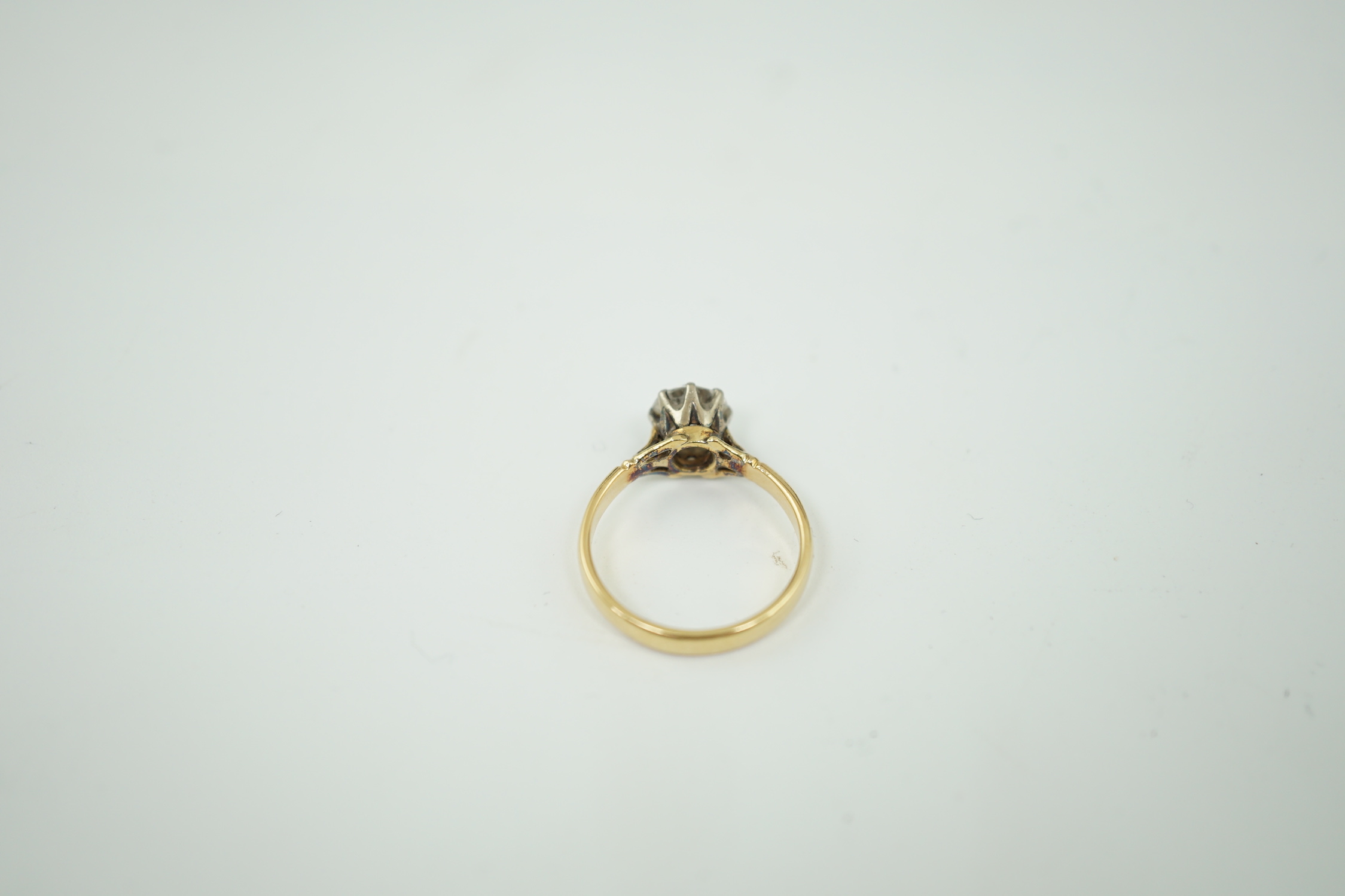 A gold and solitaire diamond set ring